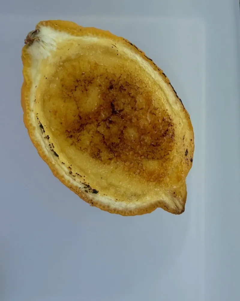 Crème brûlée with a caramelised sugar crust, served in half a lemon.