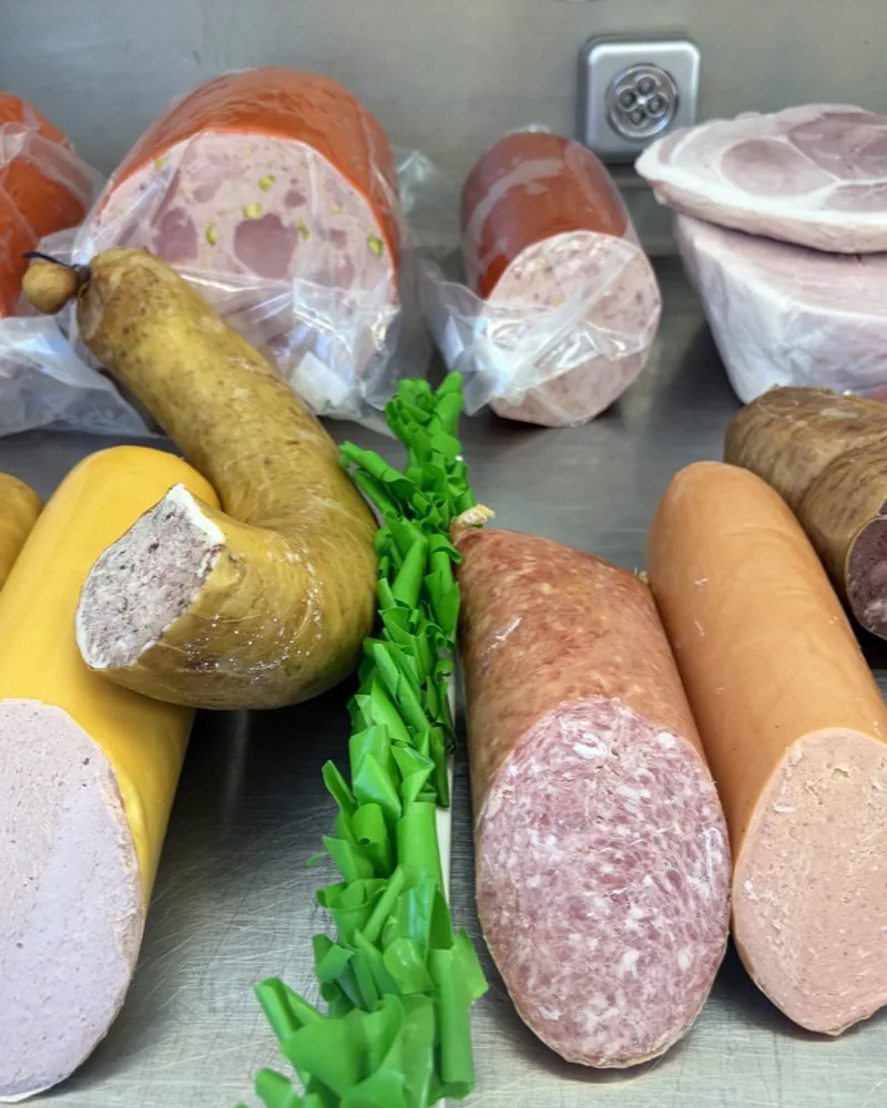 Various sausages and cold cuts on the counter at Ralf's Fine Foods at the Bötzowmarkt.